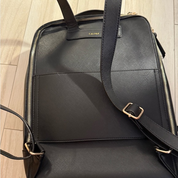 Calpak Black Backpack with Sleek Design and Gold Accents - Picture 2 of 4